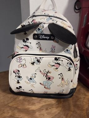 Disney Cream Mini Backpack with Black Trim and Colorful Character Print